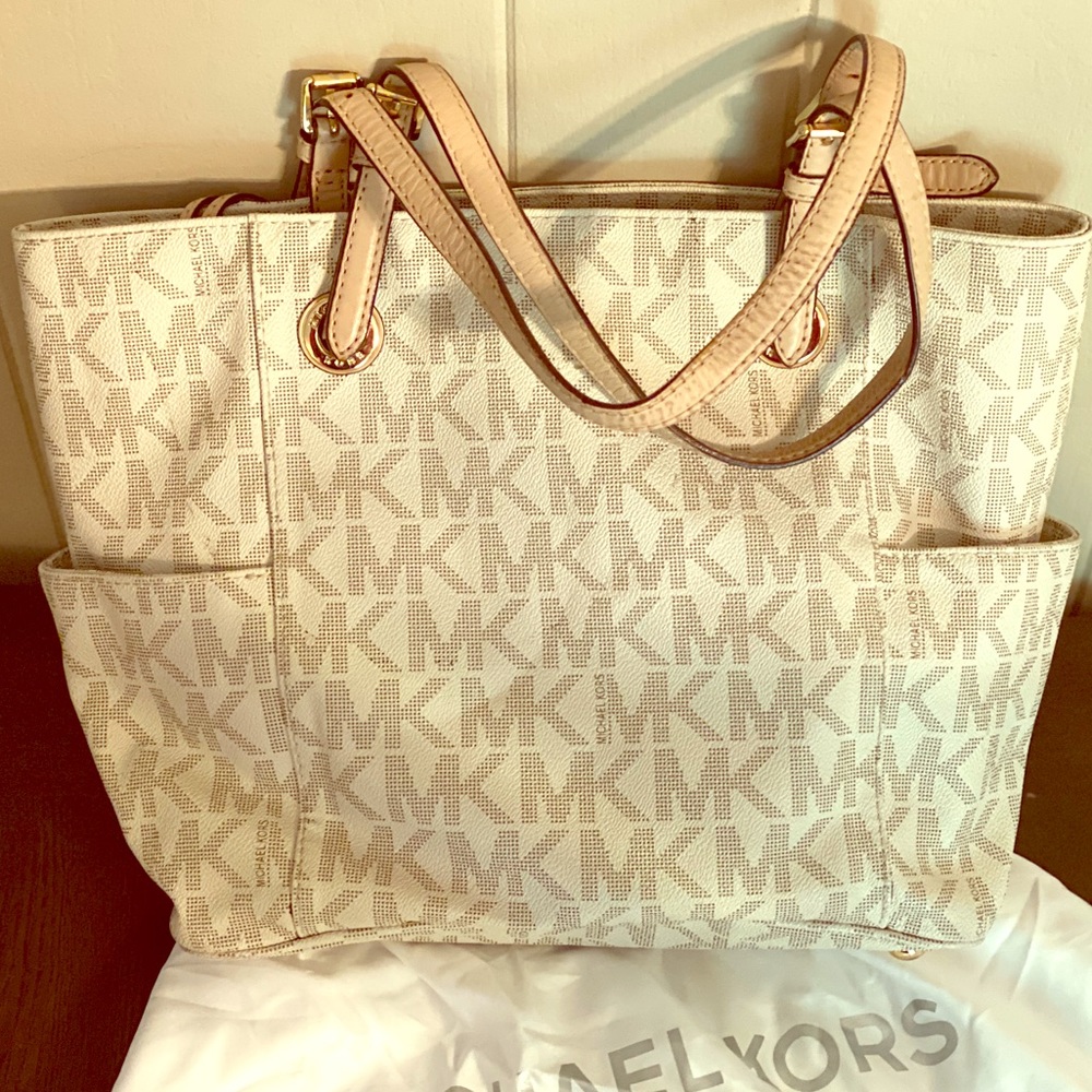 Michael Kors monogram shoulder bag.